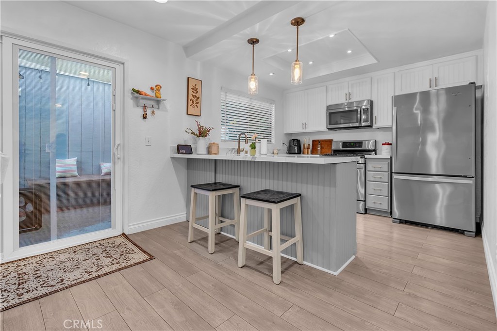 15251 Leffingwell Road, Unit 8 Whittier, CA 90604 - Photo 7 of 26 a kitchen with stainless steel appliances granite countertop a refrigerator and a stove top oven