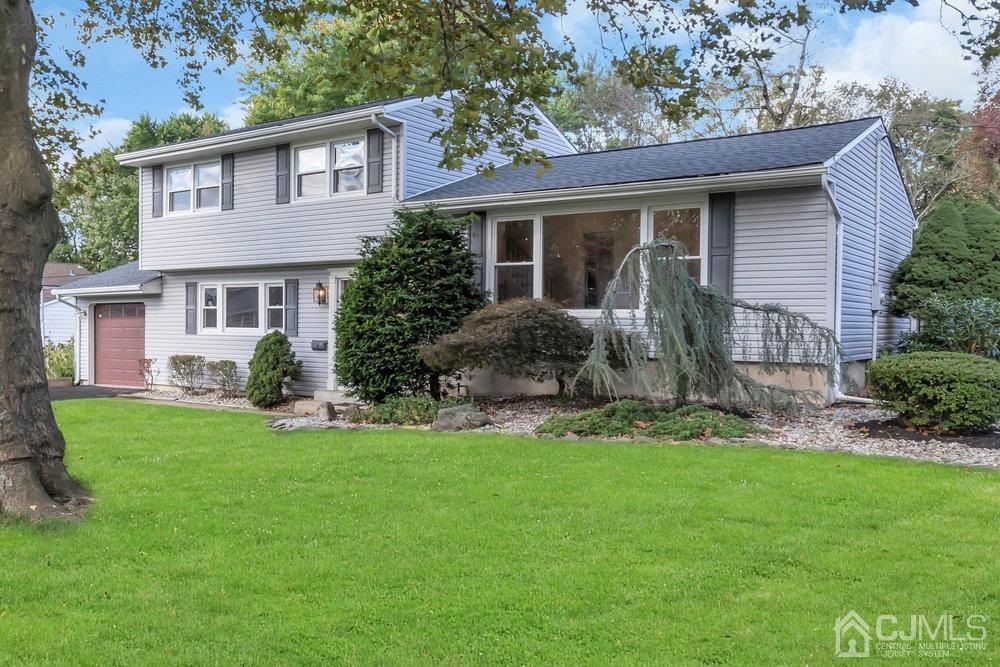 7 Bruning Road East Brunswick, NJ 08816 - Photo 2 of 20 a front view of a house with a yard and porch