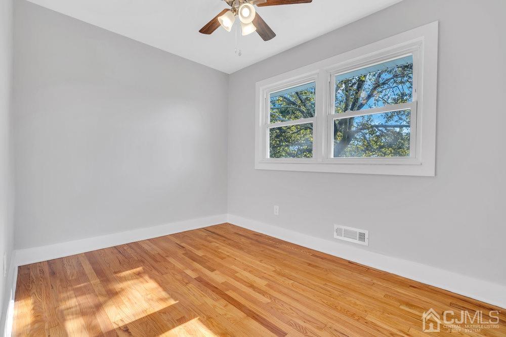 7 Bruning Road East Brunswick, NJ 08816 - Photo 11 of 20 an empty room with a window