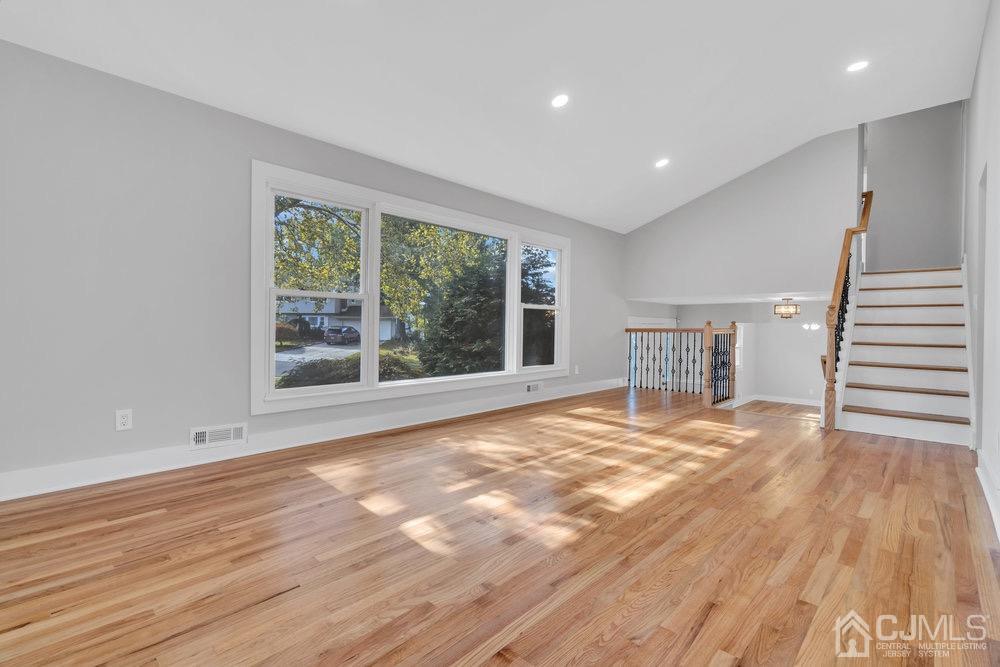 7 Bruning Road East Brunswick, NJ 08816 - Photo 12 of 20 a view of an empty room with wooden floor and a window