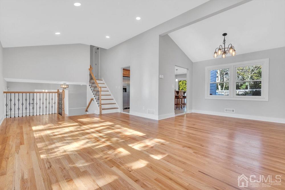 7 Bruning Road East Brunswick, NJ 08816 - Photo 13 of 20 a view of a bedroom with wooden floor and windows