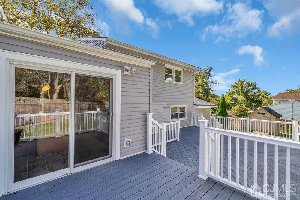 7 Bruning Road East Brunswick, NJ 08816 - Photo 17 of 20 a view of a deck with chair and wooden floor