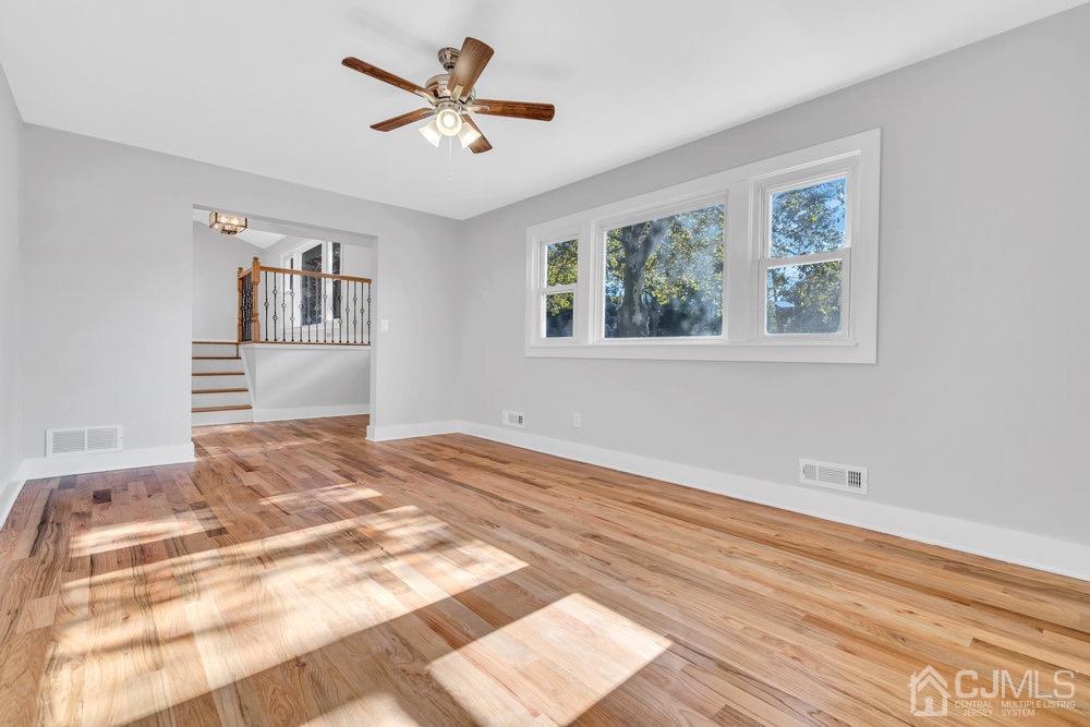 7 Bruning Road East Brunswick, NJ 08816 - Photo 5 of 20 a view of a bedroom with wooden floor and window