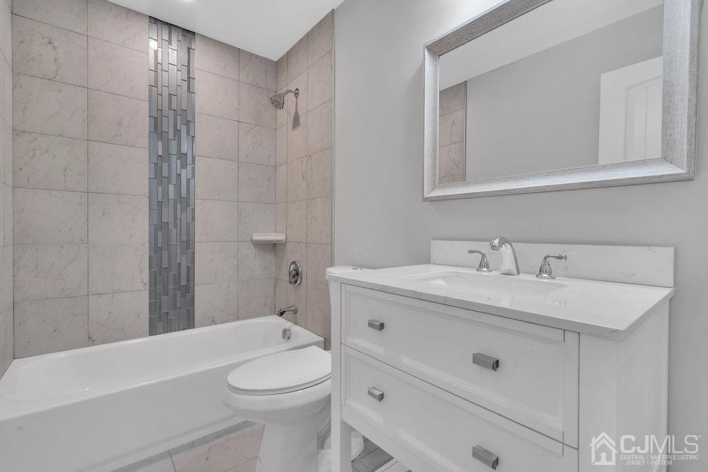 7 Bruning Road East Brunswick, NJ 08816 - Photo 10 of 20 a bathroom with a sink a toilet and shower