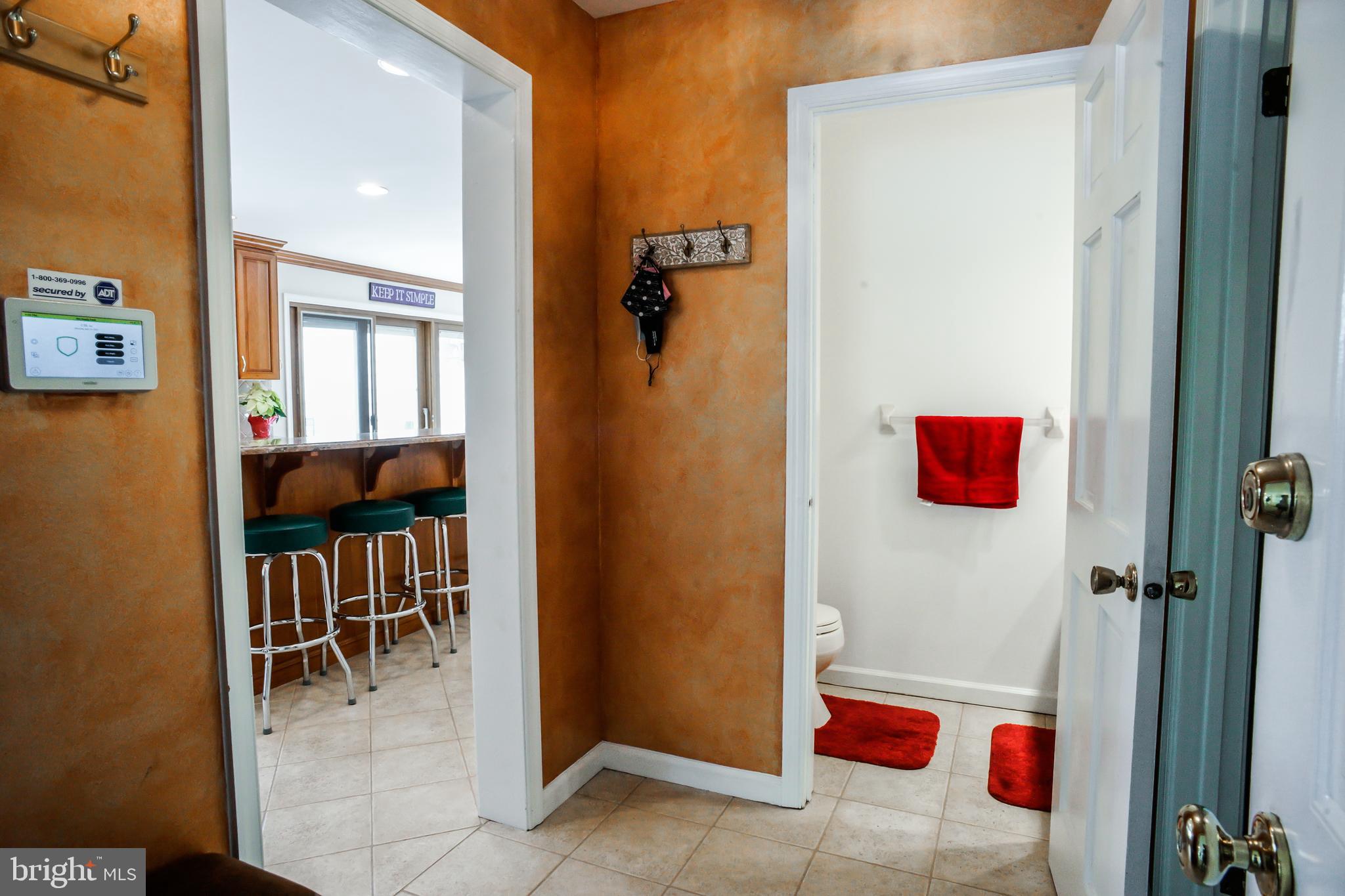 4 Beechwood Circle Chadds Ford, PA 19317 - Photo 42 of 129 Half bath off of the kitchen & garage entry