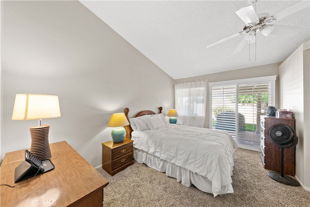 26592 Braddock Road Menifee, CA 92586 - Photo 12 of 23 a bedroom with a bed a window and couch