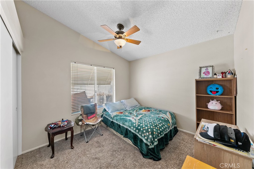 26592 Braddock Road Menifee, CA 92586 - Photo 17 of 23 a bedroom with a bed and a window