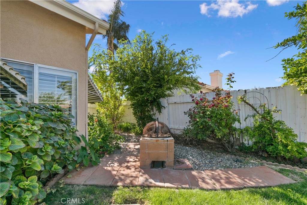 26592 Braddock Road Menifee, CA 92586 - Photo 22 of 23 a view of a yard with plants and a fountain