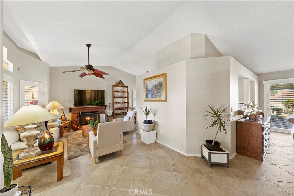 26592 Braddock Road Menifee, CA 92586 - Photo 5 of 23 a living room with furniture a flat screen tv and a window
