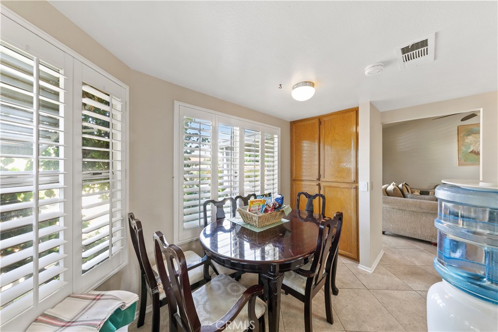 26592 Braddock Road Menifee, CA 92586 - Photo 9 of 23 a dining room with furniture and window