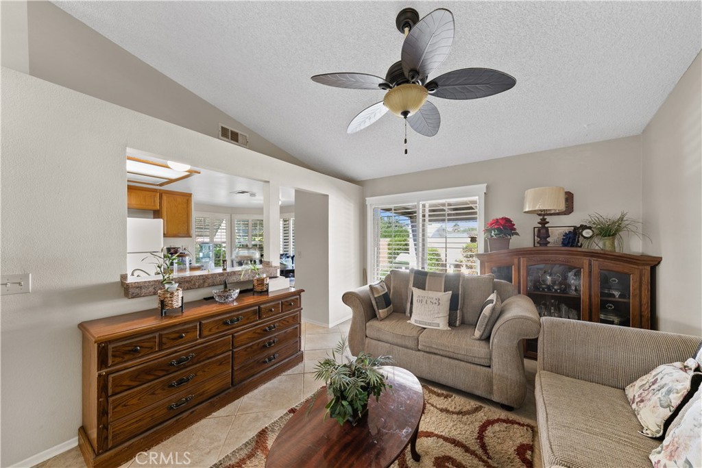 26592 Braddock Road Menifee, CA 92586 - Photo 10 of 23 a living room with furniture and a large window