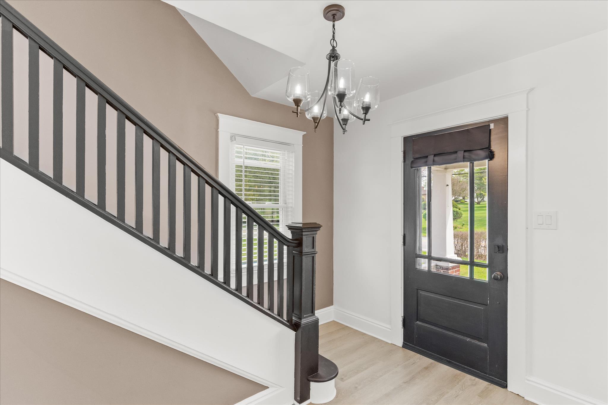 310 Hanover Road York, PA 17408 - Photo 6 of 56 a view of a hallway with windows and chandelier