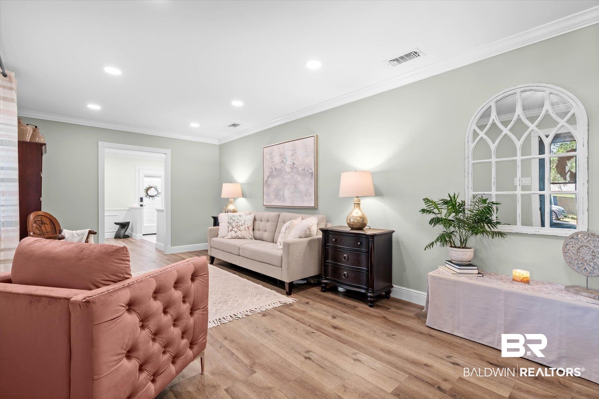 101 Ann Street Daphne, AL 36527 - Photo 2 of 38 Spacious living area featuring wood-finish flooring, recessed lighting, crown molding, and a wide entryway