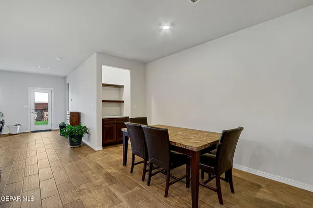 a kitchen with stainless steel appliances a stove a sink island and a refrigerator