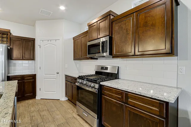 a view of a livingroom with furniture and a potted plant