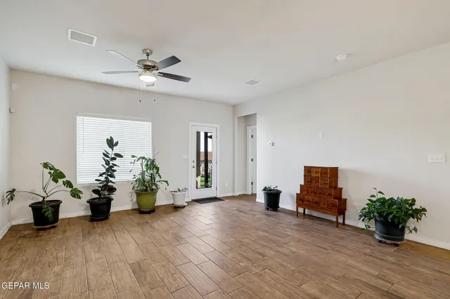 a view of kitchen with furniture potted plant and open kitchen view