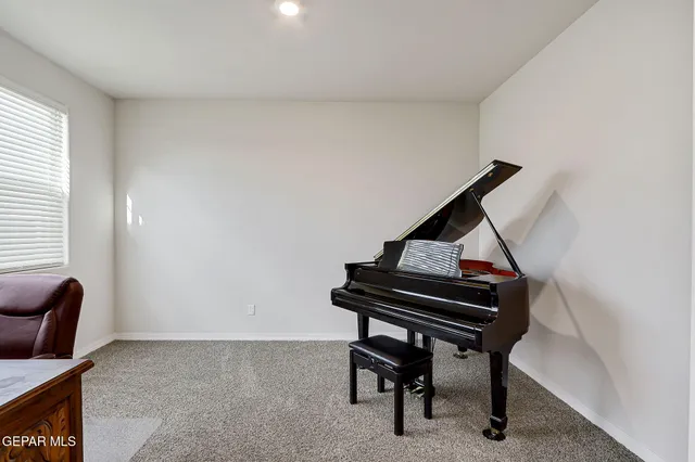 a view of a workspace with furniture