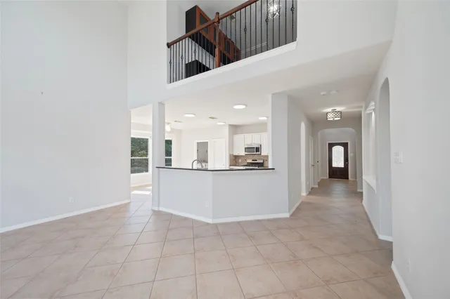 a view of a living room with a kitchen