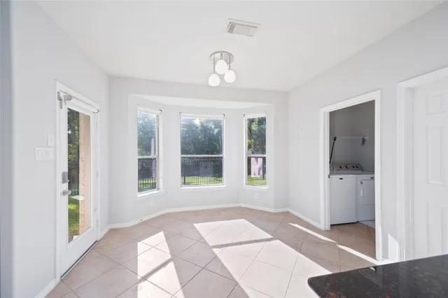 a view of an empty room with a window