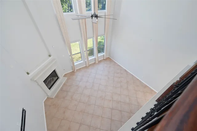 a view of an empty room and wooden floor
