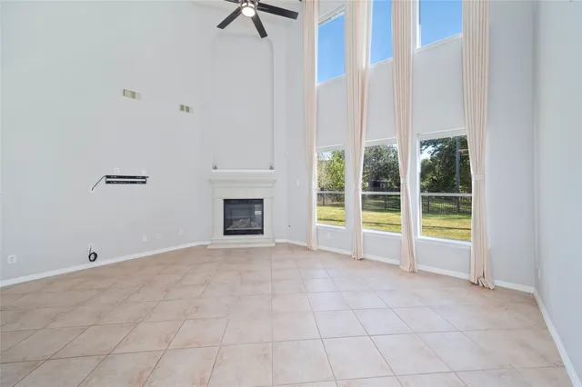 a view of an empty room with a fireplace