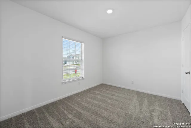 a bathroom with a granite countertop sink a toilet and bathtub