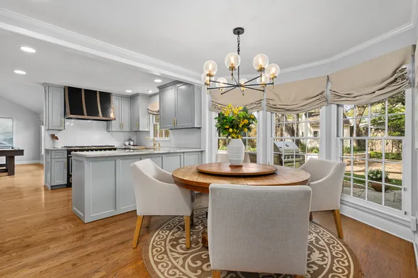 a kitchen with sink and refrigerator