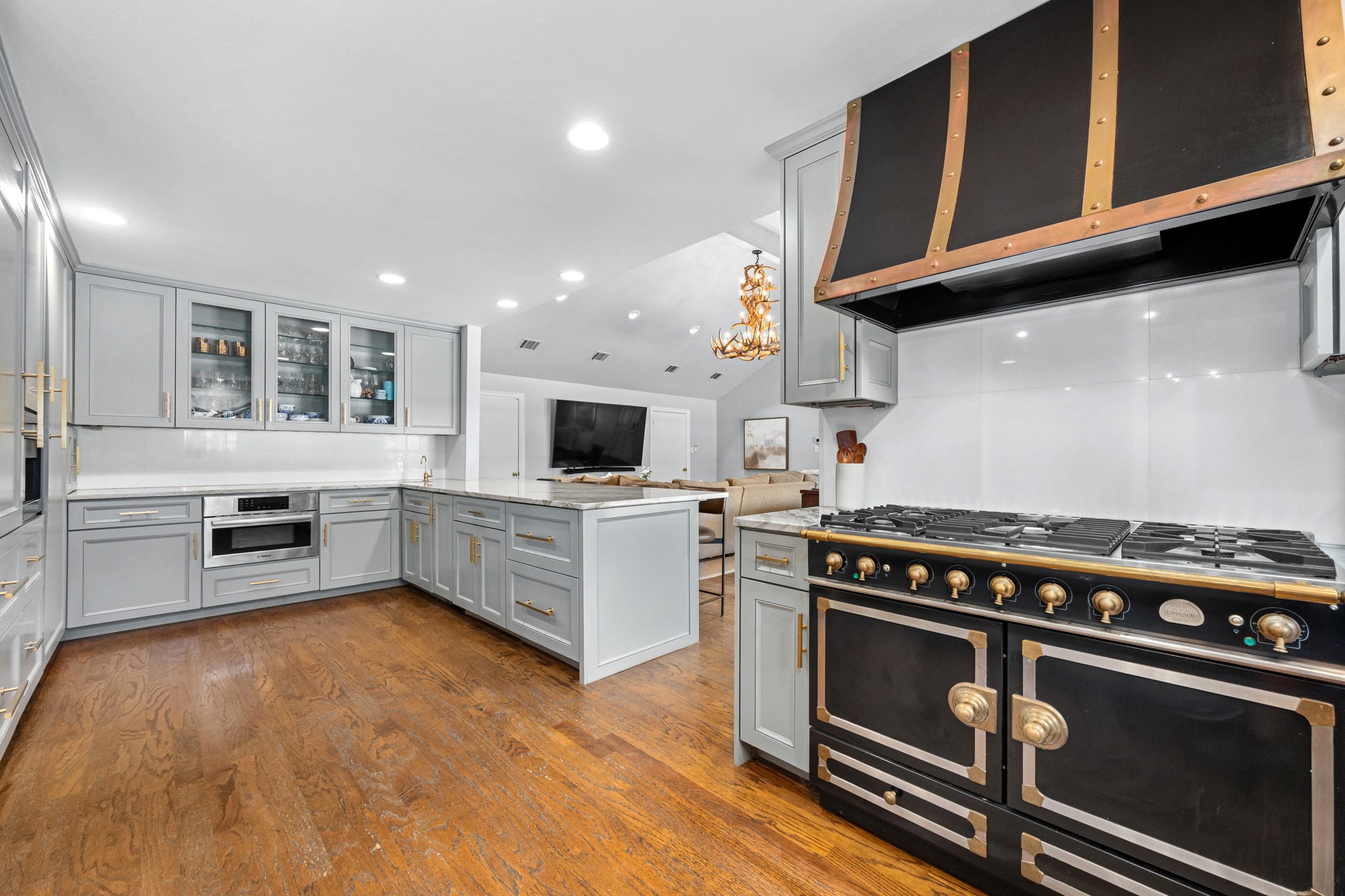 3100 Pecos Street Austin, TX 78703 - Photo 13 of 38 a kitchen with stainless steel appliances a stove a sink and a microwave