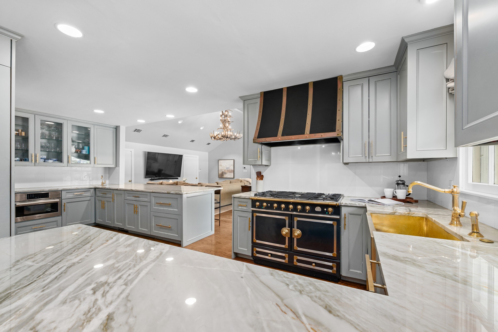 3100 Pecos Street Austin, TX 78703 - Photo 14 of 38 a kitchen with stainless steel appliances granite countertop a stove a sink and a microwave