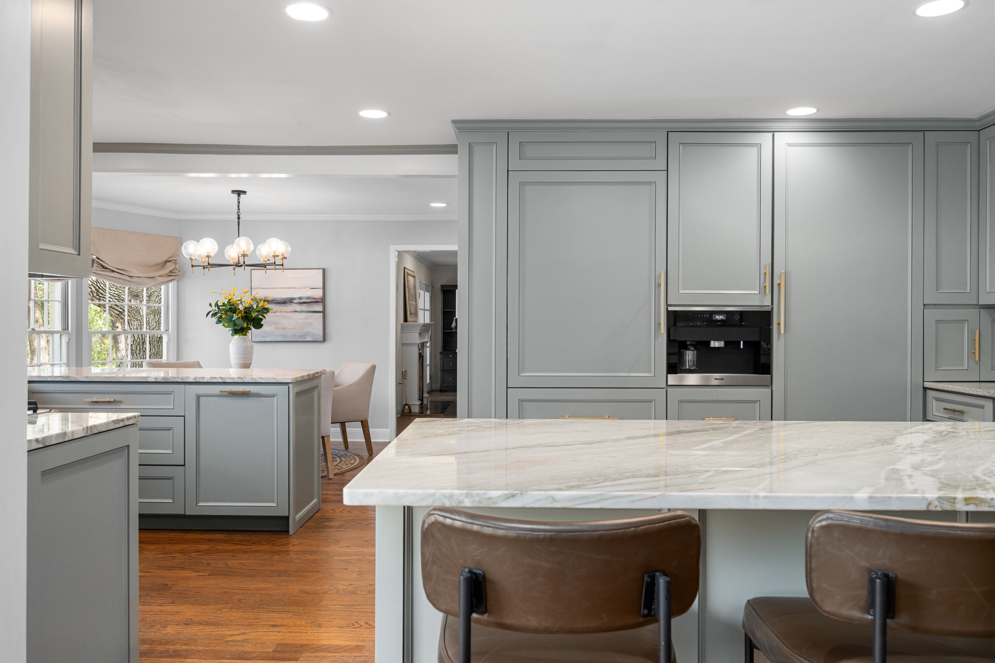 3100 Pecos Street Austin, TX 78703 - Photo 15 of 38 a kitchen with kitchen island a sink table and chairs