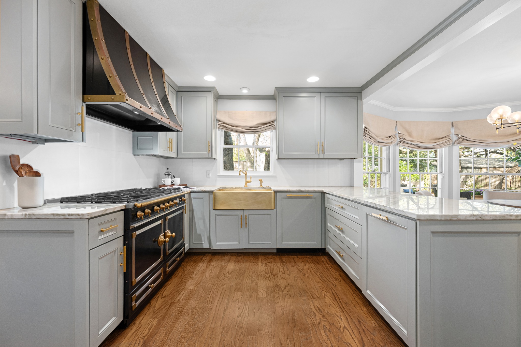 3100 Pecos Street Austin, TX 78703 - Photo 16 of 38 a kitchen with a stove sink and cabinets