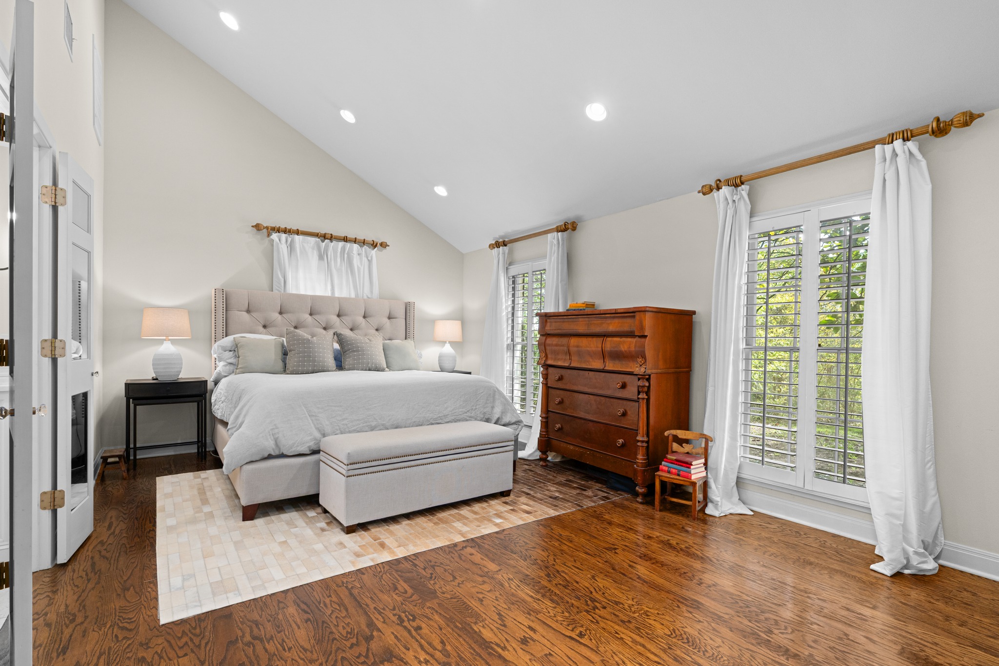 3100 Pecos Street Austin, TX 78703 - Photo 21 of 38 a bedroom with furniture and a flat screen tv