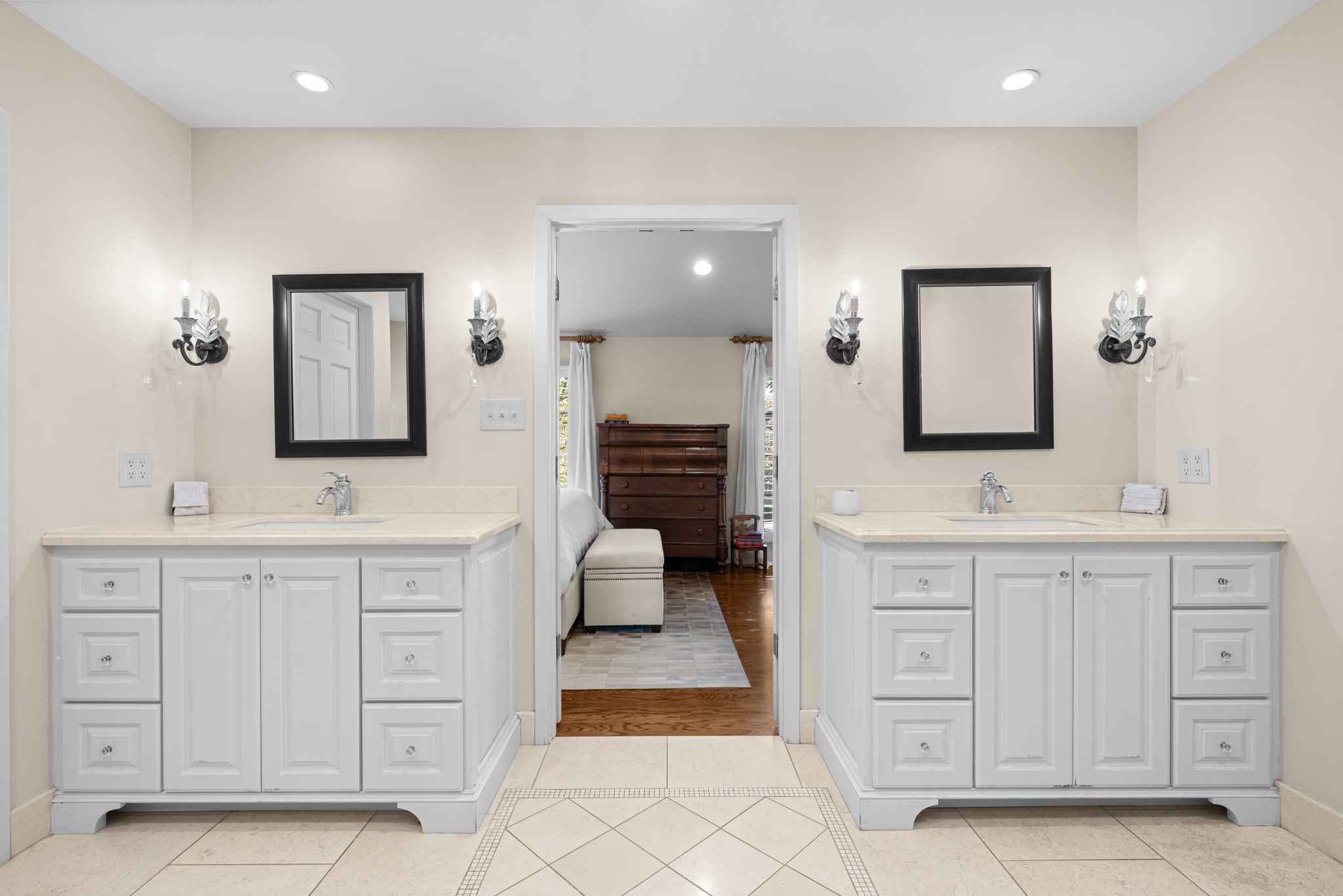 3100 Pecos Street Austin, TX 78703 - Photo 22 of 38 a spacious en suite bathroom with a double vanity sink and a mirror
