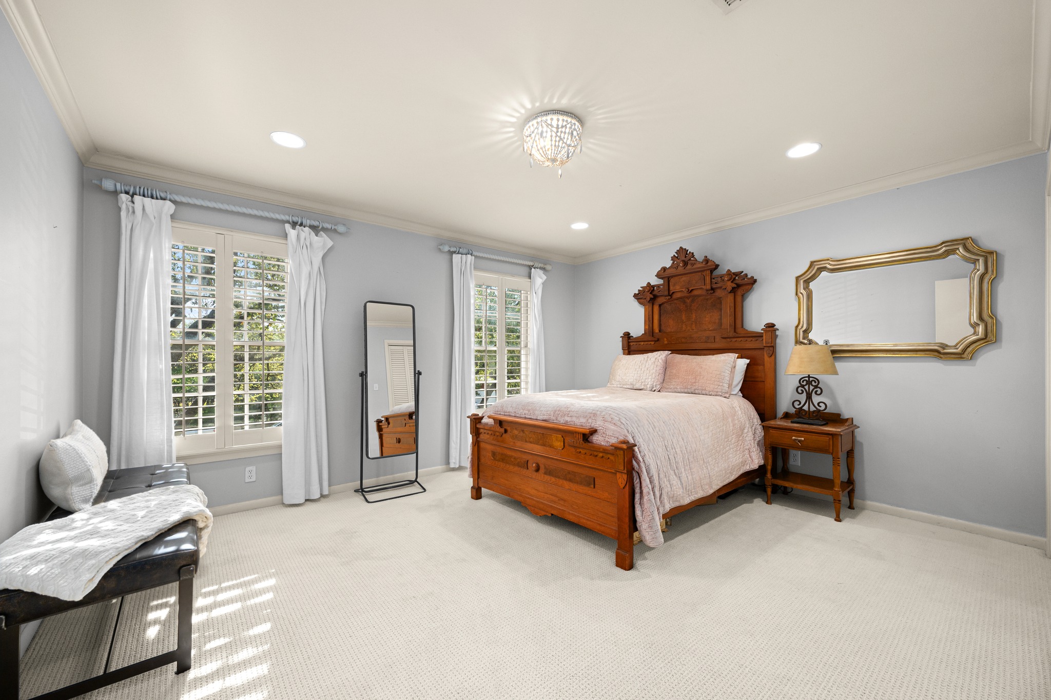 3100 Pecos Street Austin, TX 78703 - Photo 30 of 38 a bedroom with a bed couch and a window