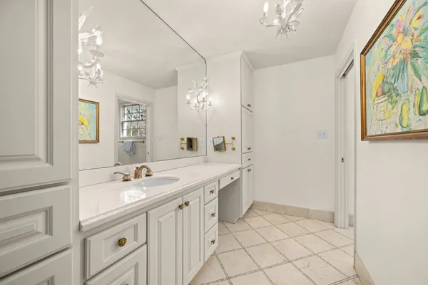 a bathroom with a sink a vanity and a mirror