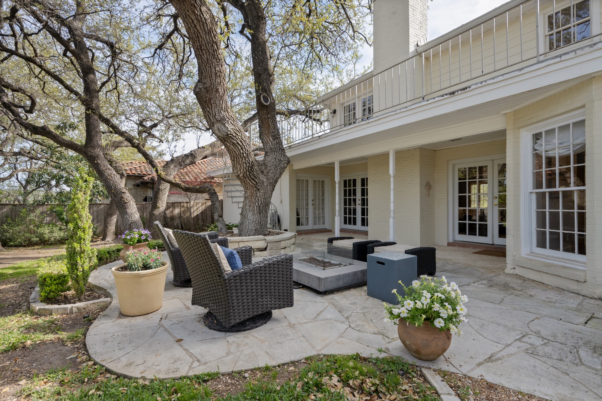 3100 Pecos Street Austin, TX 78703 - Photo 36 of 38 a view of a patio with couches table and chairs and potted plants