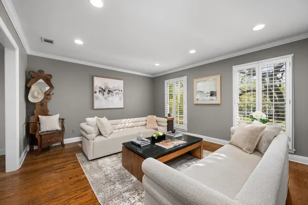 a living room with furniture rug and window