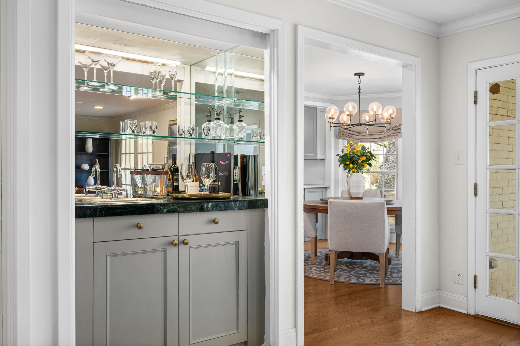 3100 Pecos Street Austin, TX 78703 - Photo 9 of 38 a room with granite countertop lots of wooden cabinets and glass door