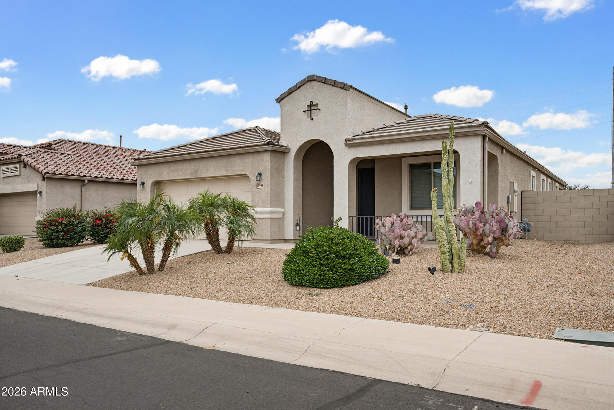 19995 North Ben Court Maricopa, AZ 85138 - Photo 6 of 51 a front view of a house with garden