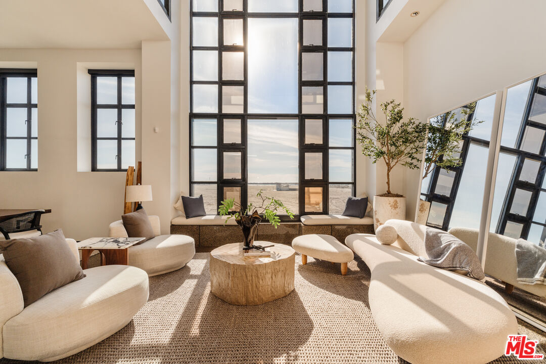 4 Yawl Street Marina del Rey, CA 90292 - Photo 11 of 34 a living room with furniture and a large window