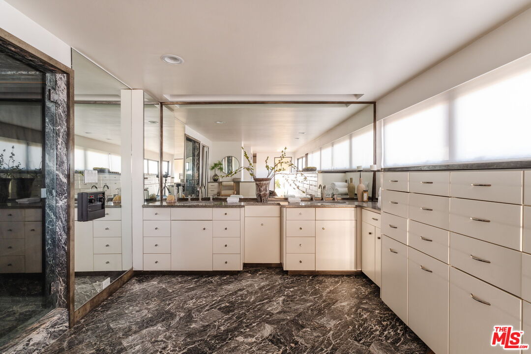4 Yawl Street Marina del Rey, CA 90292 - Photo 22 of 34 a kitchen with granite countertop white cabinets and white appliances