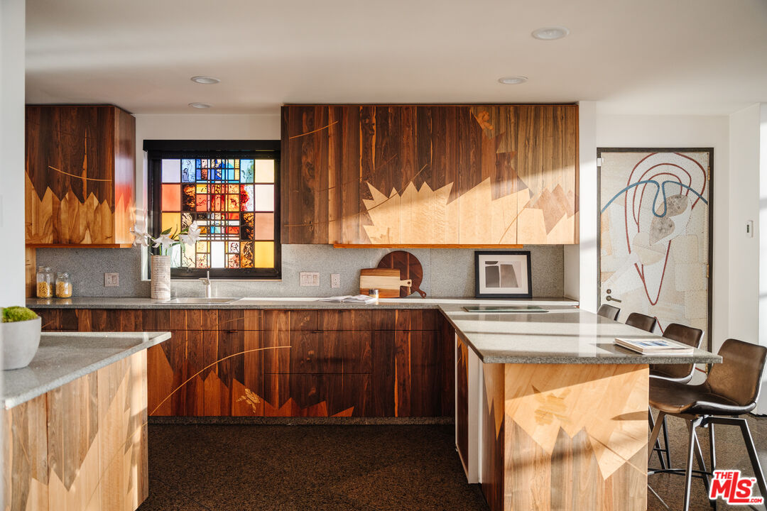 4 Yawl Street Marina del Rey, CA 90292 - Photo 8 of 34 a kitchen with stainless steel appliances granite countertop a sink stove and cabinets