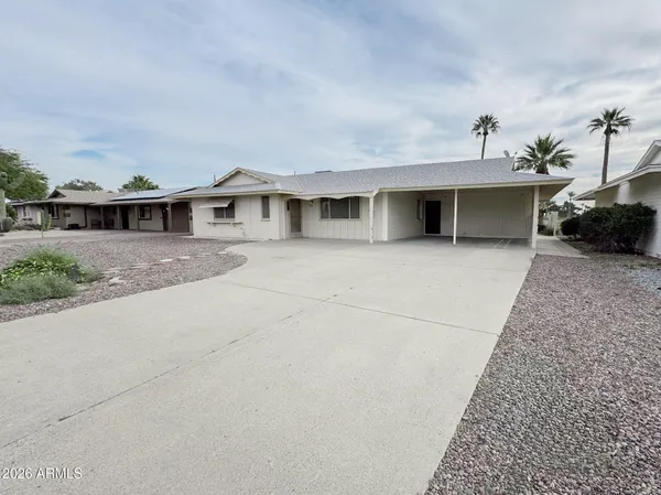 a front view of a house with yard