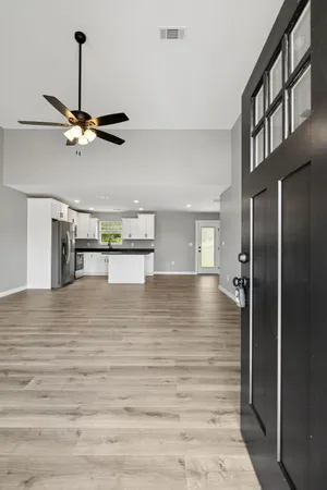 a view of room with a ceiling fan