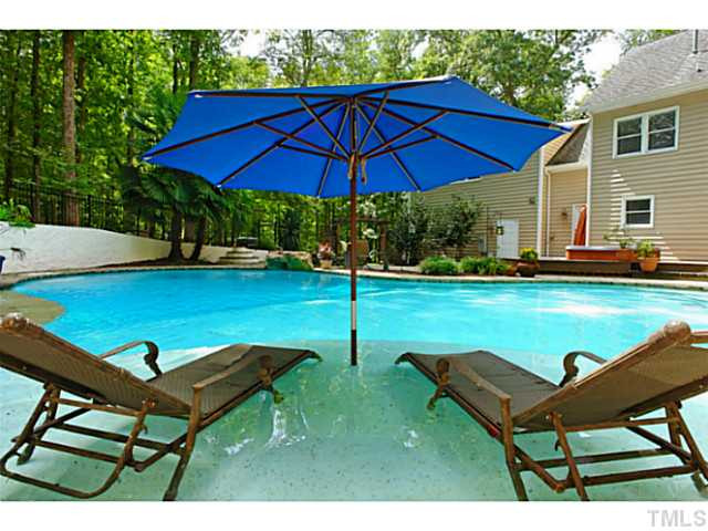 5504 Shimer Farm Lane Raleigh, NC 27614 - Photo 1 of 25 a backyard of a house with table and chairs
