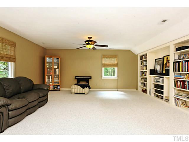 5504 Shimer Farm Lane Raleigh, NC 27614 - Photo 20 of 25 a living room with furniture and a flat screen tv