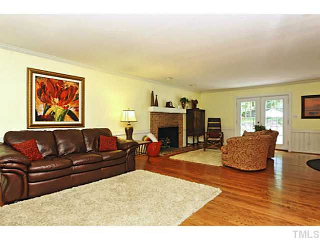 5504 Shimer Farm Lane Raleigh, NC 27614 - Photo 4 of 25 a living room with furniture and a fireplace