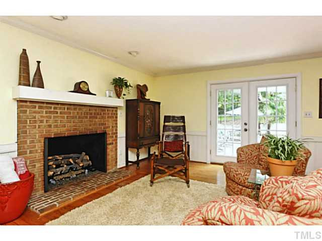 5504 Shimer Farm Lane Raleigh, NC 27614 - Photo 6 of 25 a living room with furniture and a fireplace