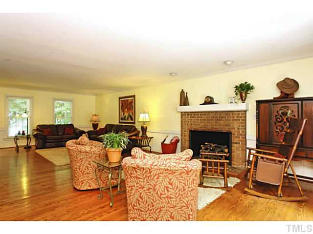 5504 Shimer Farm Lane Raleigh, NC 27614 - Photo 7 of 25 a living room with furniture and a fireplace