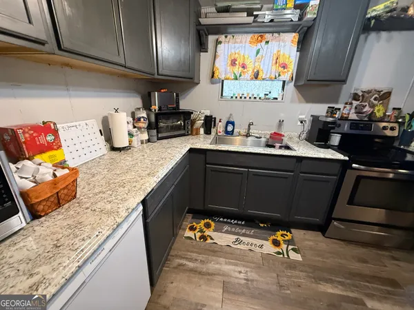 a kitchen with a sink and cabinets